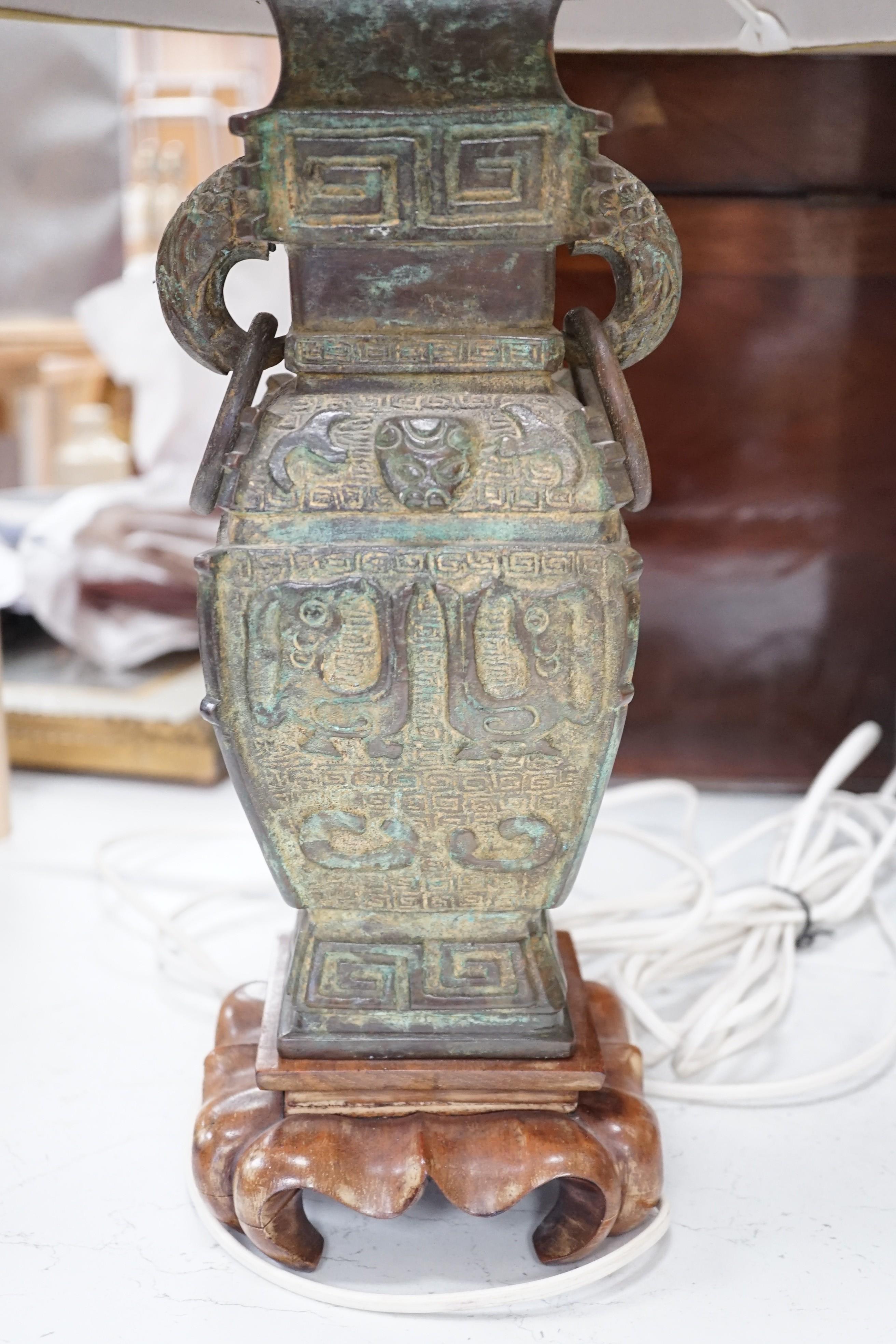 A pair of 20th century Chinese archaistic design bronze table lamps height to top of vase 37 cm
